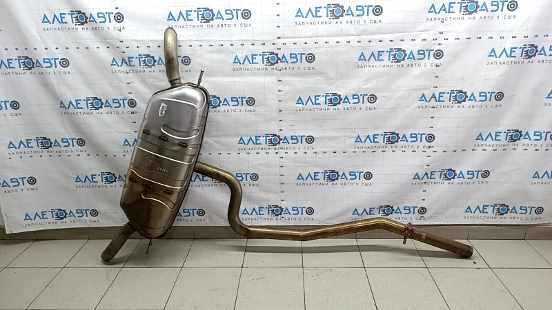 The rear muffler with a barrel for a VW Tiguan 20-24 fwd is dented.