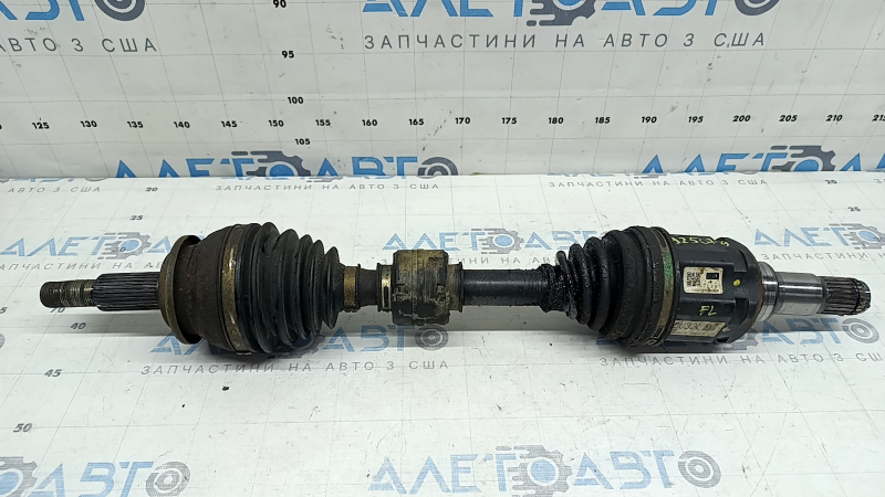 The front left half-shaft of a Toyota Rav4 16-18 hybrid is rusty and has a torn inner boot.
