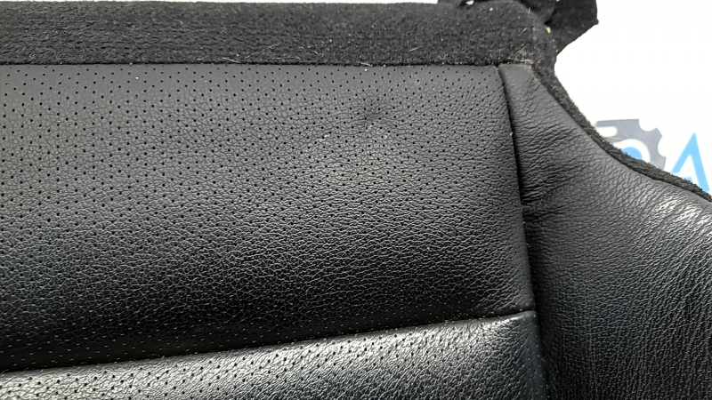 The driver's seat cushion cover for a Honda Accord 13-17 is black leather, perforated, heated, cracked, and wrinkled.