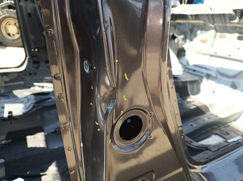 The center right body pillar of a 13-17 Honda Accord has dents on the body.