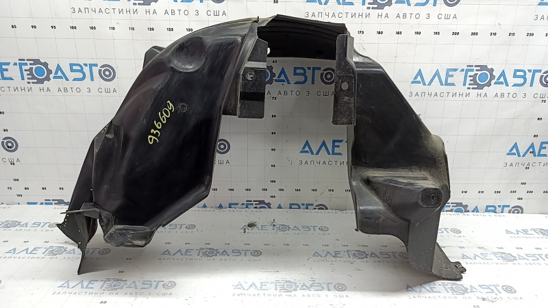 The rear right fender liner of a 19-23 Jeep Renegade is dented and the fastener is torn.
