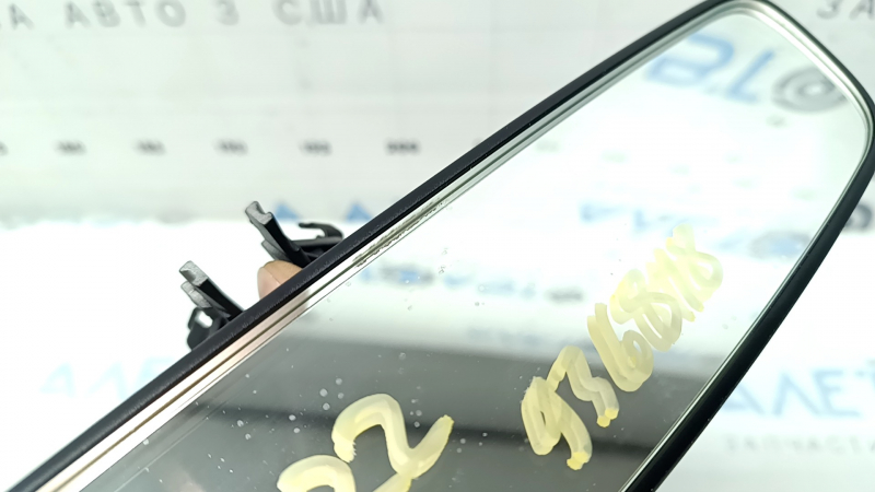 The interior mirror of a VW Jetta 19-22 is black and empty, with amalgam coming out.