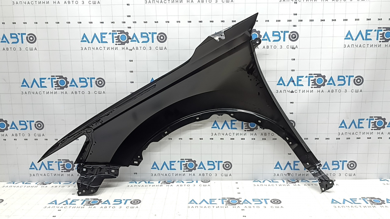 The front right fender of a Honda CRV 23-26 has a bent corner.
