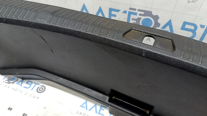 The trunk opening trim for a Toyota Avalon 13-18 is black, worn, the fastener is broken, the plastic has turned white.