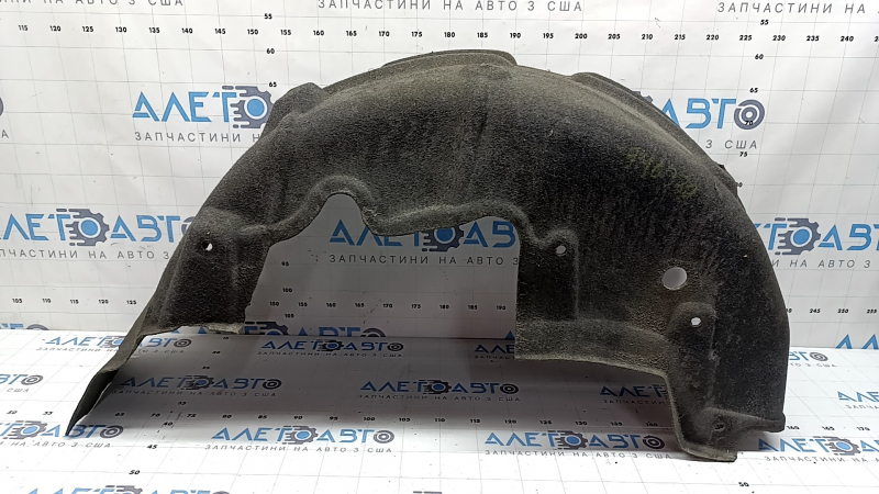 The rear right fender liner of Toyota Sienna 21-26 is dented.