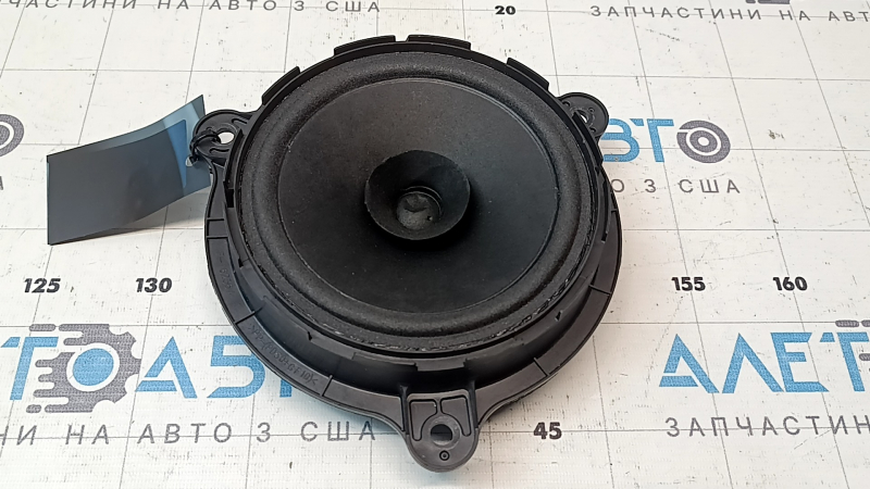 The rear left speaker of the Infiniti QX50 19-25 is dented.