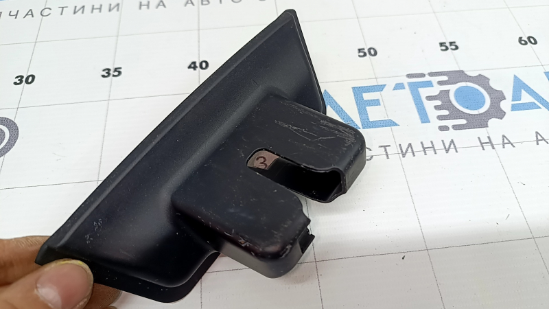 Toyota Prius 50 Prime trunk door lock trim panel with 17-22 scratches and broken mount