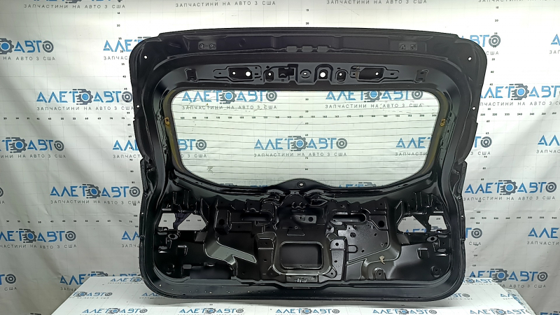 The trunk door is bare with glass, Nissan Rogue Sport 17-22 black G41, scratches on the glass.