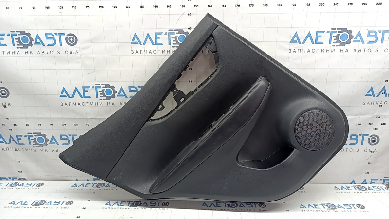 Rear left door panel for a 2022 Nissan Rogue Sport, black with black insert, black leather armrest, scratches