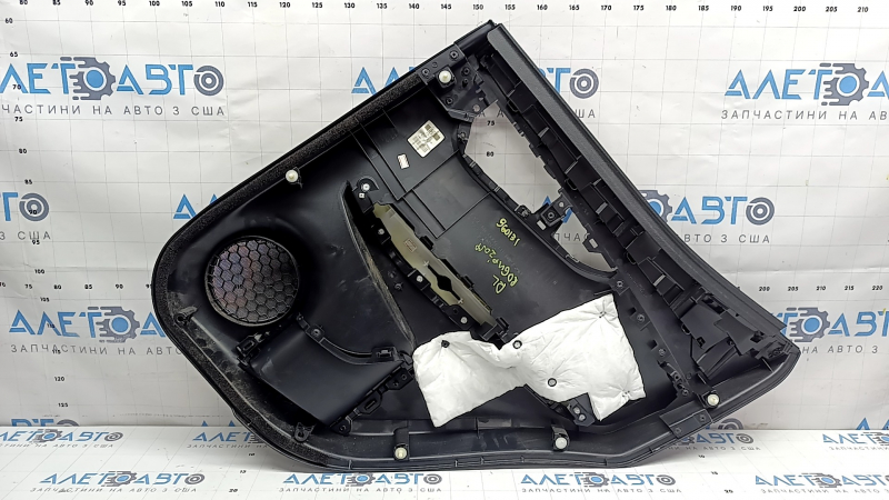 Rear left door panel for a 2022 Nissan Rogue Sport, black with black insert, black leather armrest, scratches