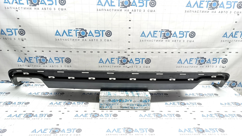 The rear bumper lip of the Audi A6 C7 16-18 restyling s-line is gray, scratches, cracked fasteners, broken fastener, chips