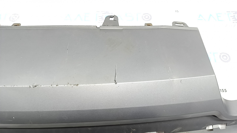 The rear bumper lip of the Audi A6 C7 16-18 restyling s-line is gray, scratches, cracked fasteners, broken fastener, chips