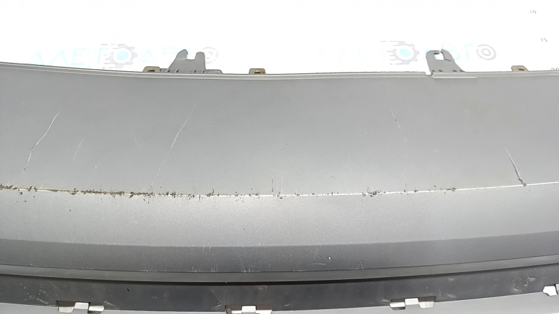 The rear bumper lip of the Audi A6 C7 16-18 restyling s-line is gray, scratches, cracked fasteners, broken fastener, chips
