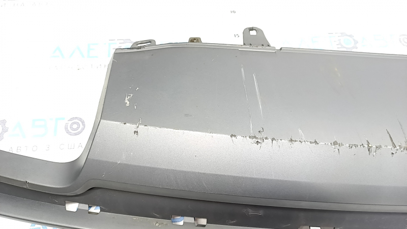 The rear bumper lip of the Audi A6 C7 16-18 restyling s-line is gray, scratches, cracked fasteners, broken fastener, chips
