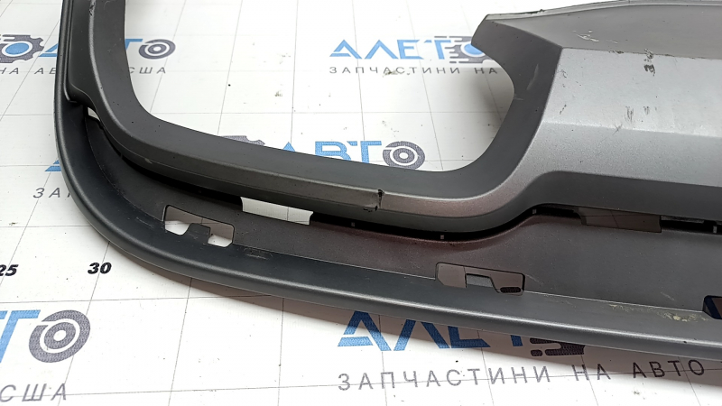 The rear bumper lip of the Audi A6 C7 16-18 restyling s-line is gray, scratches, cracked fasteners, broken fastener, chips