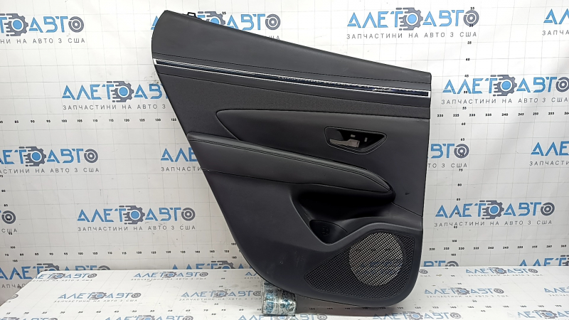 Door trim, rear left, Hyundai Tucson 22-26, black leather with black fabric insert, black leather armrest, chrome molding with black gloss, scratches, dry-cleanable, sooty