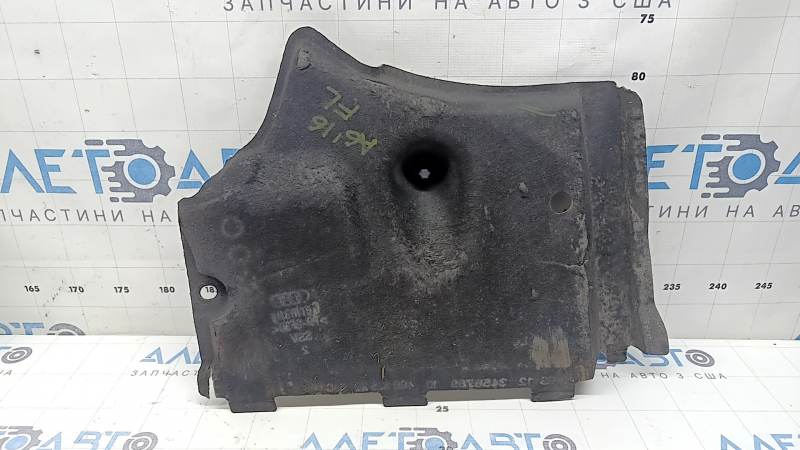 The front left underbody protection of the Audi A6 C7 12-18 is worn and torn.