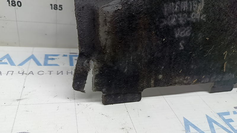 The front left underbody protection of the Audi A6 C7 12-18 is worn and torn.