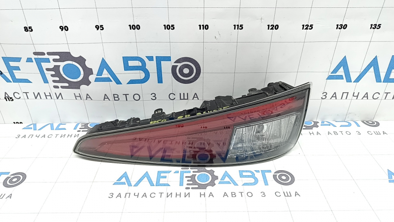 The right lower bumper light of a Toyota Prius 50 16-18 has dirty glass from the inside.