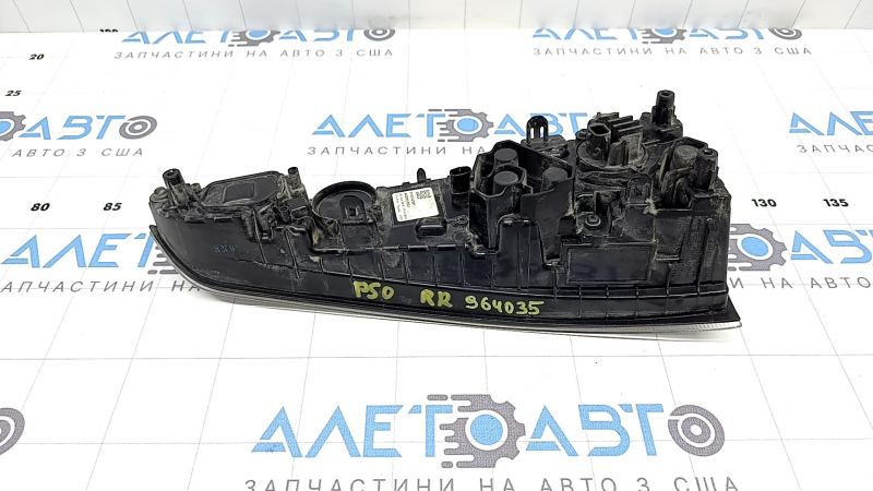The right lower bumper light of a Toyota Prius 50 16-18 has dirty glass from the inside.