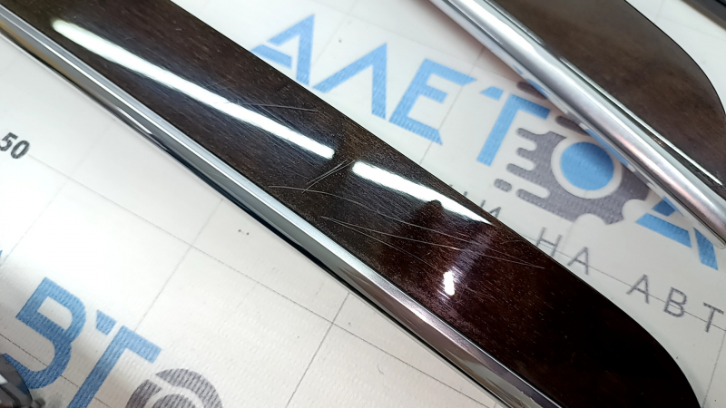 A set of interior trims for the Volvo XC90 16-25 in Classic wood / Flame birch, Bowers & Wilkins, with illumination, scratches