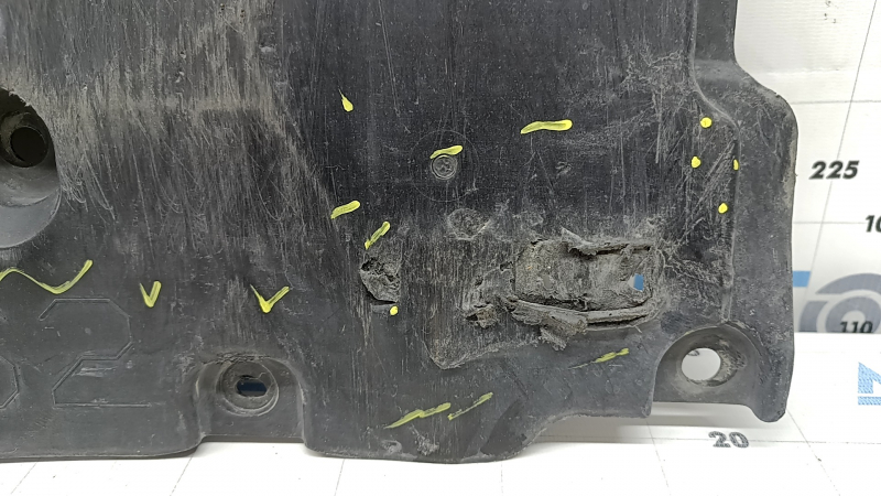 The front bumper guard of a Toyota Prius 50 16-18 is worn, torn, and dented.