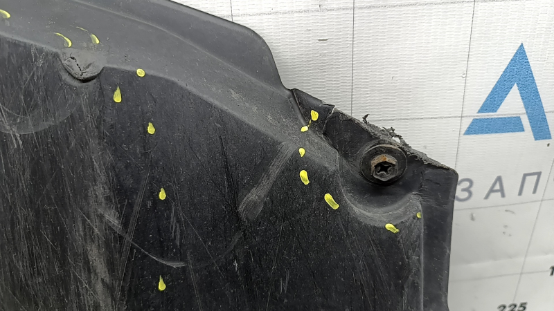 The front bumper guard of a Toyota Prius 50 16-18 is worn, torn, and dented.