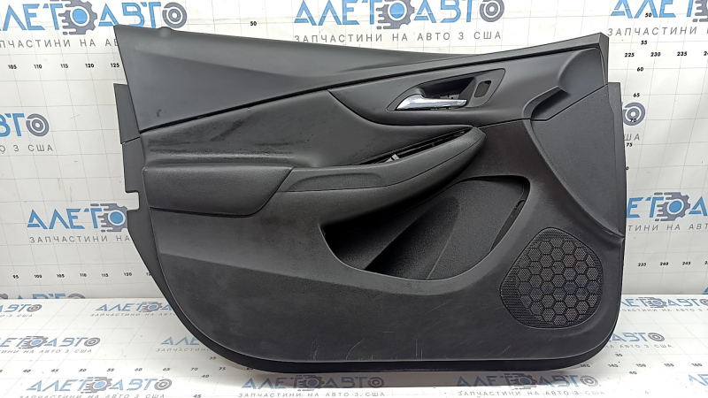 The front left door panel of a Chevrolet Volt 16 is black, with a black leather insert, the armrest is black leather, with a handle, without a trim and buttons, scratches