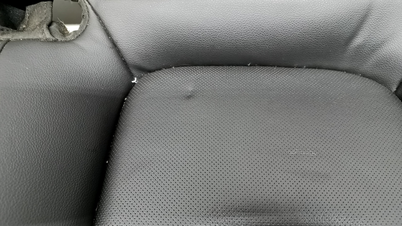Chevrolet Volt 16-18 rear seat cushion, black leather with blue stitching, perforated, dents