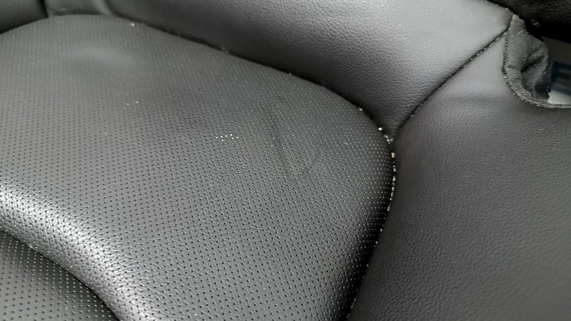 Chevrolet Volt 16-18 rear seat cushion, black leather with blue stitching, perforated, dents