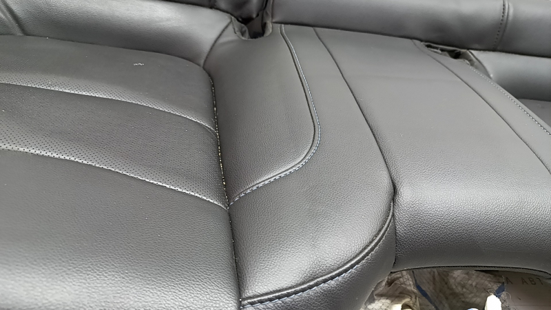 Chevrolet Volt 16-18 rear seat cushion, black leather with blue stitching, perforated, dents