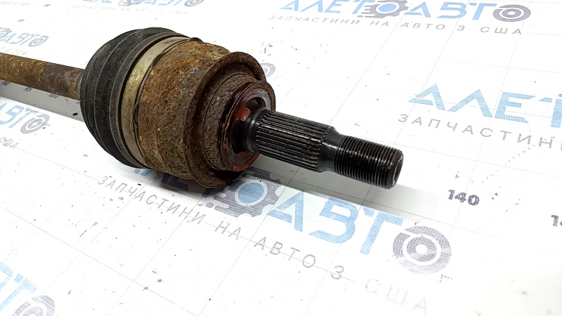 The front left half-shaft of a Chevrolet Volt 16 is rusty.
