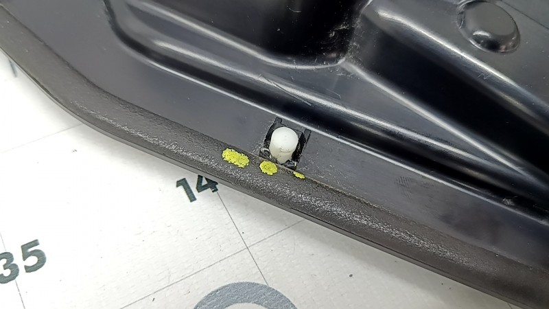 The inner rear right door panel of an Audi A6 C8 19-25 under the door closer, the fasteners are broken