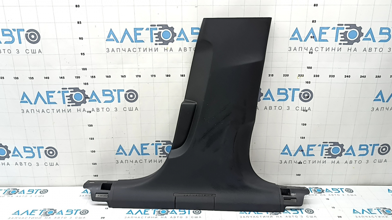 The lower right center pillar trim for an Audi A6 C8 19-25 is black, scratched, the plastic has turned white, and the mount is broken.