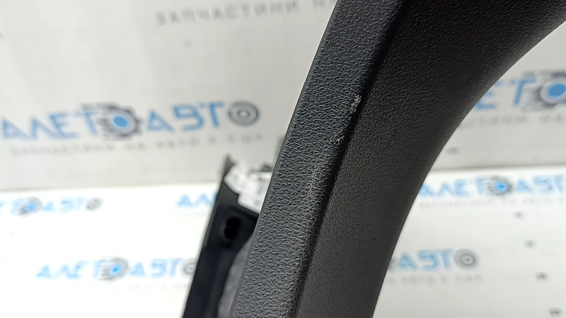 The lower right center pillar trim for an Audi A6 C8 19-25 is black, scratched, the plastic has turned white, and the mount is broken.