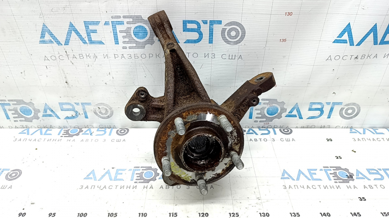 The front left axle with hub for a Ford Escape MK4 20-26 AWD is rusty; the hub needs replacing.