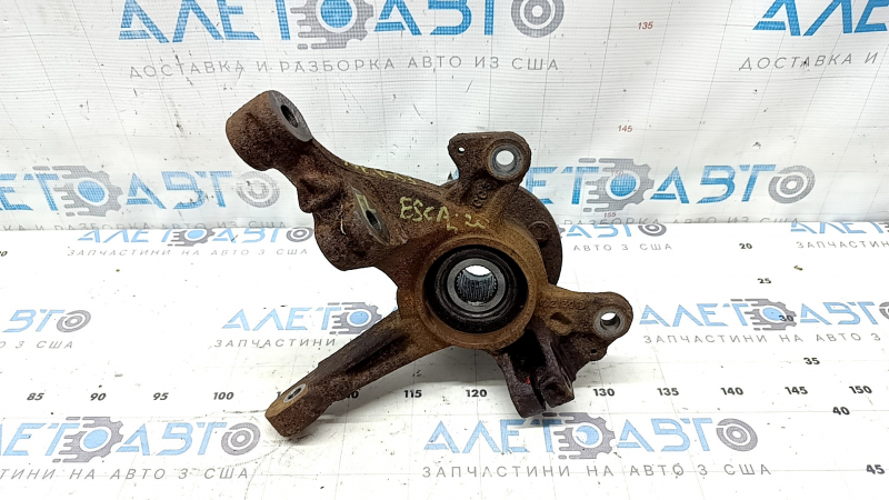 The front left axle with hub for a Ford Escape MK4 20-26 AWD is rusty; the hub needs replacing.