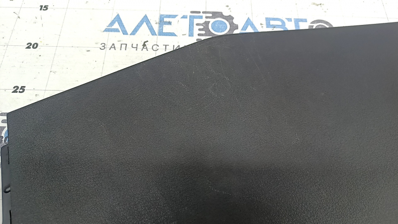 Mazda 3 19-21 4D black center console trim, lower left side, Japan built, scratches