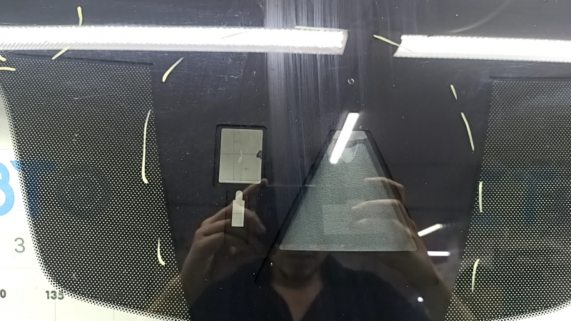 Mazda 3 19-23 windshield with camera and rain sensor, Japan built, air vents along the edge, chips, scratches