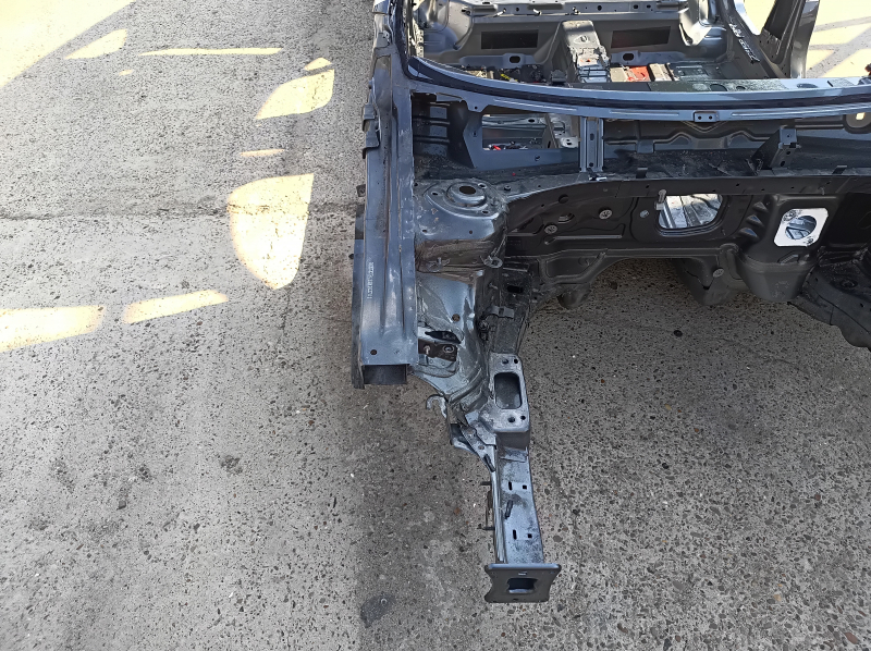 Front right quarter panel of a 19-26 VW Jetta on the body, graphite, dented threshold