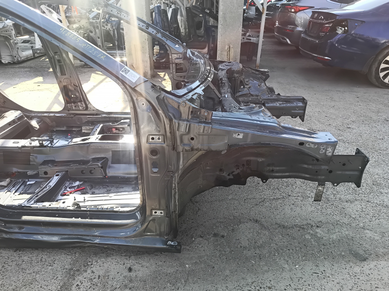 Front right quarter panel of a 19-26 VW Jetta on the body, graphite, dented threshold