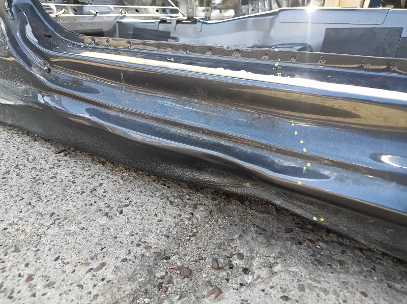 Front right quarter panel of a 19-26 VW Jetta on the body, graphite, dented threshold