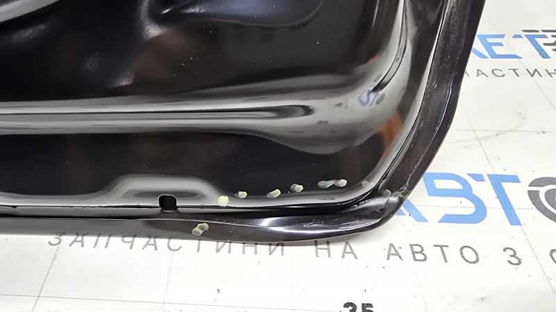 The front left door of a Toyota Prius 50 19-22 is bare and has a bent corner.