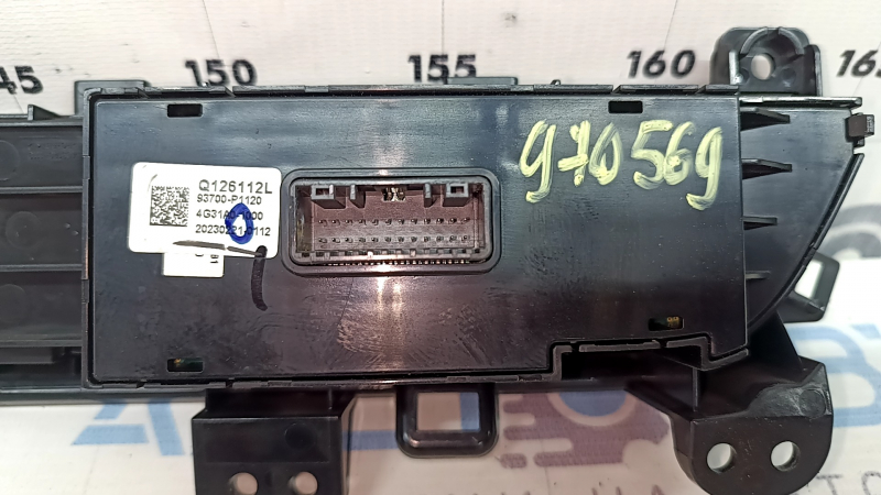 Left front panel button block for Kia Sportage 23-25 under electric trunk door, paint is melted, scratches