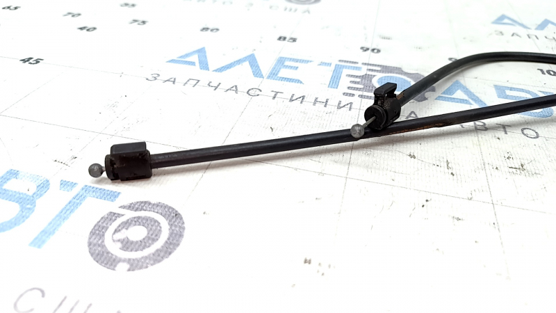 The insulation on the front hood release cable of a Volvo XC90 16-26 has dried out.