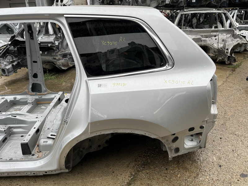 Quarter wing rear left Volvo XC90 16-26 on the body, silver, dented threshold, bumps at sunset