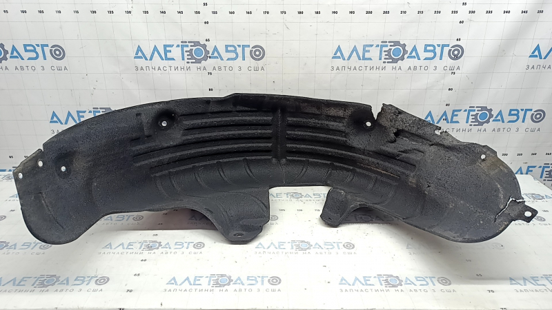 The rear left fender liner of a Hyundai Santa Fe 24-26 is torn and dented.