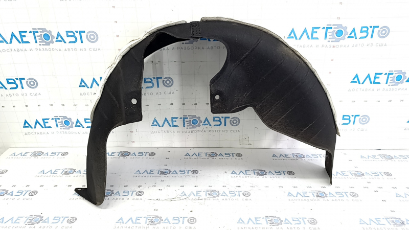 The rear left fender liner of a Kia Sportage 23-26 has a torn fastener.