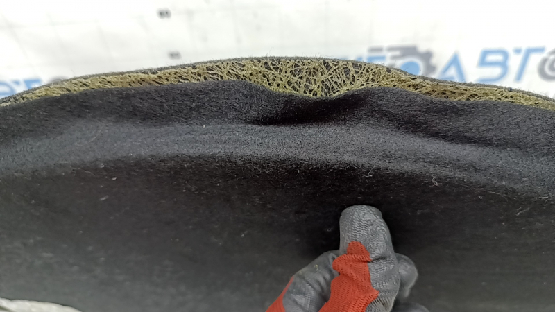 The trunk floor of a Ford Fusion mk5 13-20 plug-in has come unstuck.