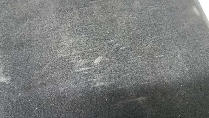 The trunk floor of the Audi A5 F5 19-25 5D is black and dented.